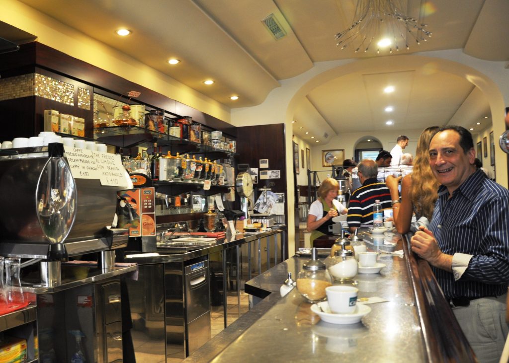 Italian coffee bar. Everyone is standing. 